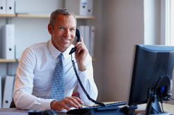 man_onphone_computer.jpg man_onphone_computer.jpg